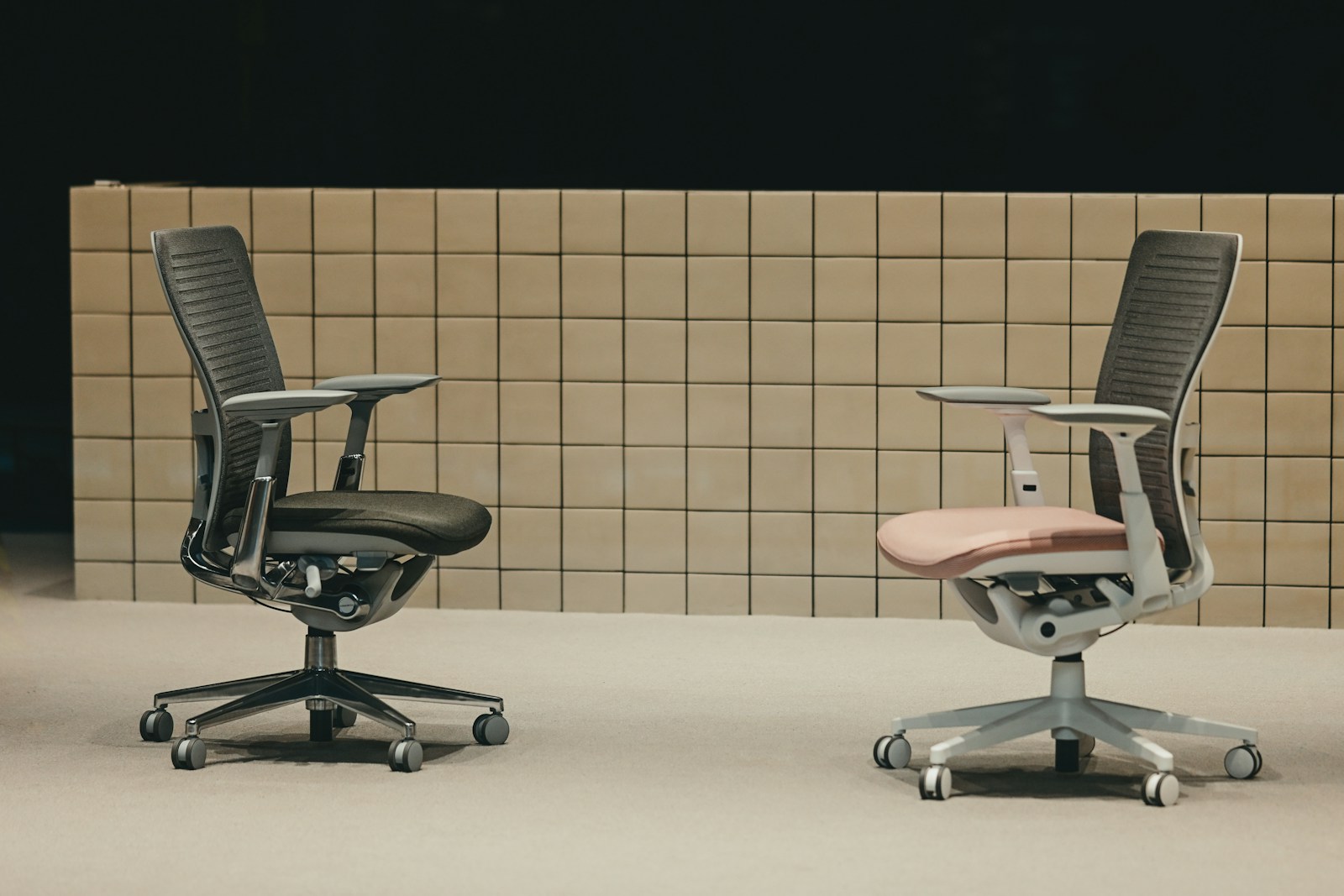 Illustrative reference photograph of two ergonomic rolling office chairs; not NicLogistics inventory.