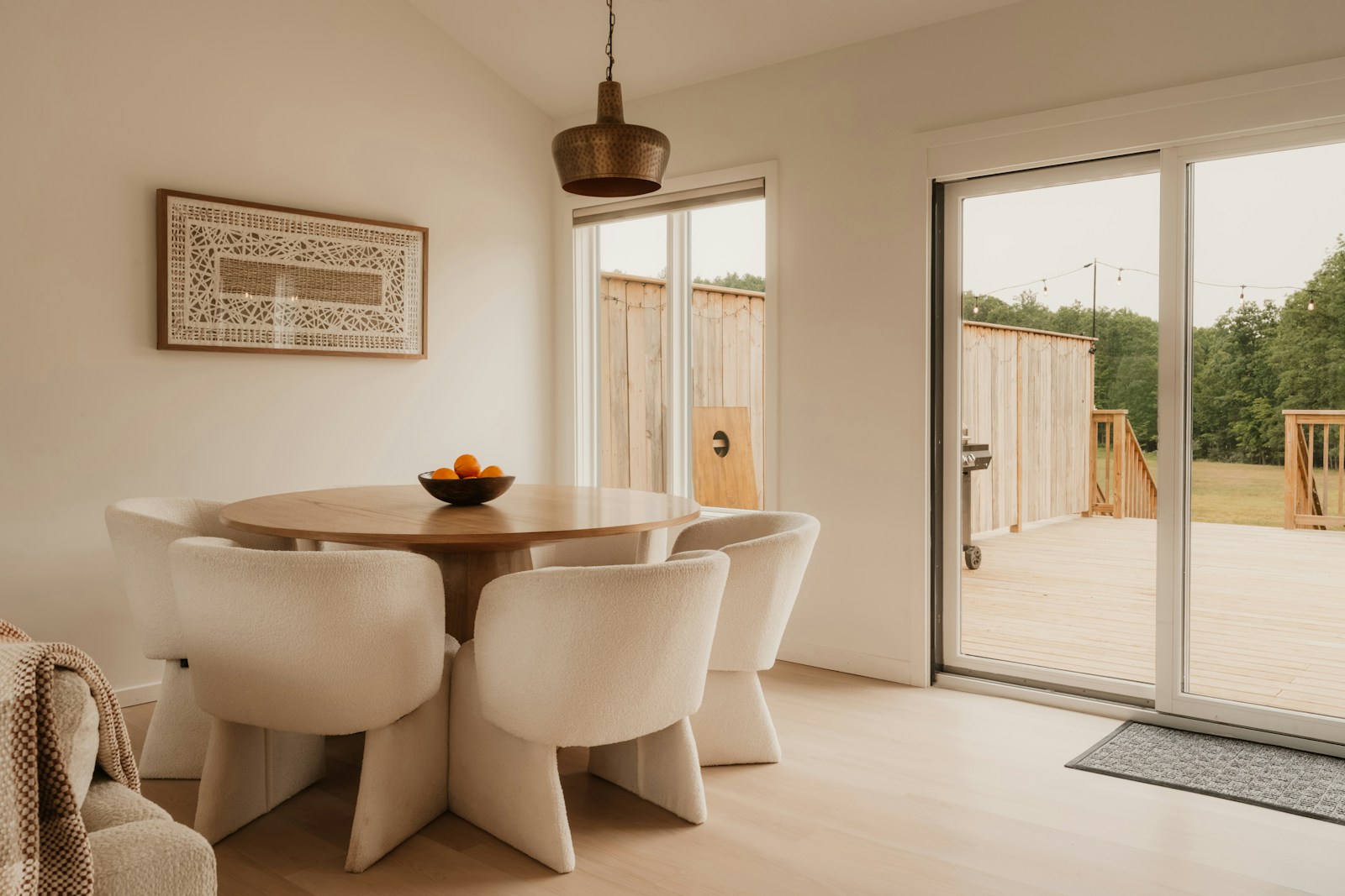 Illustrative reference photograph of a round wooden dining table with upholstered chairs; not NicLogistics inventory.